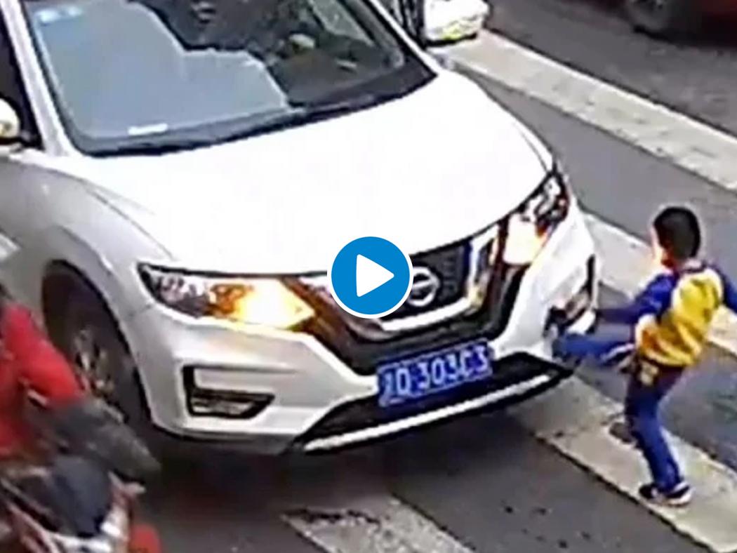 Image result for This little boy in China is his mummy's big hero - he vented his anger at a car that sent his mum flying