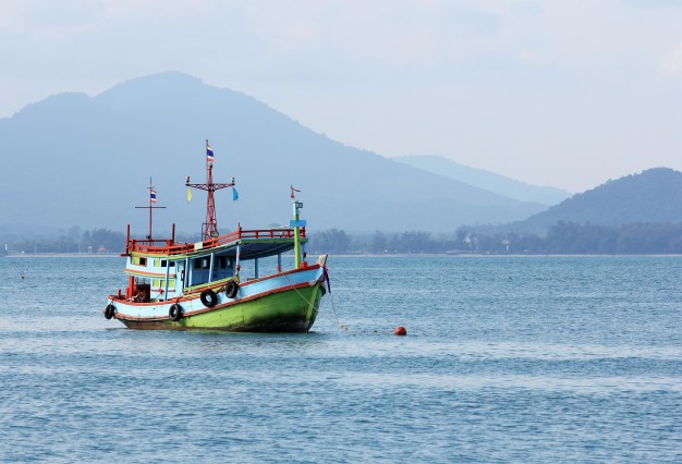 Small Wooden Boat Fishing in the Sea Editorial Photo - Image of