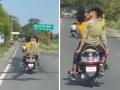 Boy Kissing Video: आता तर हद्द झाली; धावत्या स्कूटीवर दोन तरुणांचा रोमान्स, व्हिडिओ व्हायरल... - Marathi News | UP Boys Kissing on scooty Video viral: Two boys kissing on a running scooty UP | Latest uttar-pradesh News at Lokmat.com