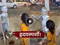 "लोक फक्त फोटो काढत राहिले, पण तिने त्याची भूक ओळखली अन्..."; काळजाला भिडणारा Video - Marathi News | Video emotional moment as little girl feeds street performer child dressed as gandhi | Latest sakhi News at Lokmat.com
