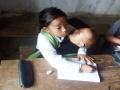 Emotional Story: अवघ्या नेटकऱ्यांच्या डोळ्यांत अश्रू तरळले; १० वर्षांची विद्यार्थिनी लहान भावाला मांडीवर घेऊन शाळेत बसतेय - Marathi News | Emotional, trending Story: Tears well up in the eyes of netizens; A 10 year old Manipuri girl is sitting at school, studying with her younger brother on her lap | Latest social-viral News at Lokmat.com