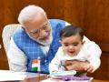 पंतप्रधान मोदींच्या कुशीतला 'तो' चिमुकला कोण? जाणून घ्या... - Marathi News | PM Modi Posted a Photo with a Special Friend in Parliament and social media Wants to Know Who it is | Latest national News at Lokmat.com