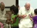Raksha Bandhan : दिग्गजांनी साजरी केली राखी पौर्णिमा - Marathi News | Raksha Bandhan : Children tie Rakhi to PM Narendra Modi and President Ram Nath Kovind on the occasion of Raksha Bandhan | Latest national Photos at Lokmat.com