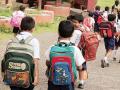 Mumbai: भर पावसात रेनकोटसह कुणी रडत तर कुणी हसत पोहोचले शाळेत! - Marathi News | Heartwarming photos of Mumbais tiny tots returning to School after the summer break | Latest mumbai News at Lokmat.com