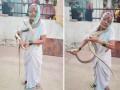 आजीबाई जोमात, नागोबा कोमात; 8 फूट लांब सापाला अलगद पकडले, पाहा Video - Marathi News | Snake Video: Grandma caught 8-foot long snake watch the video | Latest social-viral News at Lokmat.com