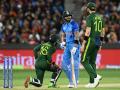 T20 World Cup : भारतीय संघाने चाहत्याचे ६ लाख रुपये वाचवले; IND vs PAK सामन्यात मैदानावर नेमके असे काय घडले? - Marathi News | T20 World Cup : The fan who invaded the field in the match between India and Pakistan has gotten away from an approx 6 Lakhs INR fine, as team India didn't file a complaint against him. | Latest cricket Photos at Lokmat.com