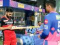 IPL 2021 : रियान परागने बॅटवर घेतली विराट कोहलीची स्वाक्षरी - Marathi News | Virat Kohli Signs Riyan Parag’s Bat, RCB Skipper’s Gesture Goes Viral After Bangalore Beat Rajasthan in IPL 2021  | Latest cricket News at Lokmat.com
