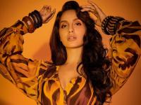 पर्पल गाऊनमध्ये 'दिलबर गर्ल'च्या हॉट अदा - Marathi News | nora fatehi did new photoshoot in purple gown | Latest filmy Photos at Lokmat.com
