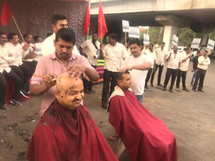 Collective shave of HAL workers | एचएएल कामगारांचे सामुहिक मुंडण