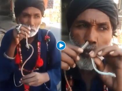 Shocking! Man put snake in the nose and taken out of the mouth watch viral video | बाप रे बाप! नाकातून टाकलेला साप तोंडातून काढला बाहेर, थरारक व्हिडीओ व्हायरल