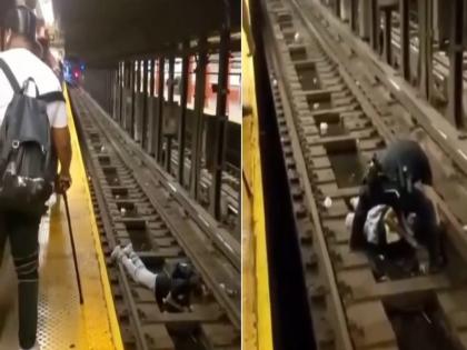 Viral video : Man fainted on platform and fell on the railway tracks | Video: बेशुद्ध होऊन रेल्वे ट्रॅकवर पडला होता 'तो', काही सेकंदाच्या अंतरावर होता मृत्यू अन् तेव्हाच