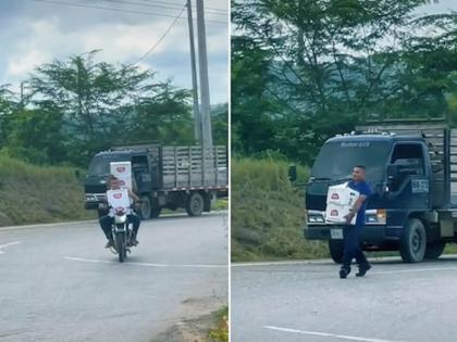 A video of a truck full of beer boxes overturned and people stole the bottles is going viral | बिअरच्या बॉक्सने भरलेला ट्रक भररस्त्यात उलटला; मदत करण्याऐवजी बाटल्या घेऊन लोकांनी काढला पळ