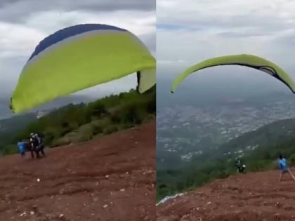 Video: 'He' ran to go paragliding and fell into a valley! Watching the video will make you heartbroken | Video: पॅराग्लायडिंग करण्यासाठी 'तो' धावत गेला अन् दरीत कोसळला! व्हिडीओ बघून चुकेल काळजाचा ठोका Video: 'He' ran to go paragliding and fell into a valley! Watching the video will make you heartbroken | Video: पॅराग्लायडिंग करण्यासाठी 'तो' धावत गेला अन् दरीत कोसळला! व्हिडीओ बघून चुकेल काळजाचा ठोका