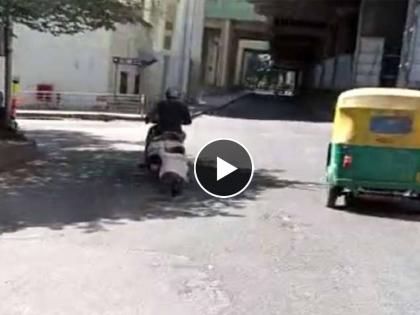 After an accident in Bangalore, a video of a person being tried running by a bike rider is going viral and a case has been registered against the accused  | इथे माणुसकी संपली! अपघातानंतर दुचाकीस्वाराने नेले फरफटत; व्हिडीओ व्हायरल होताच गुन्हा दाखल