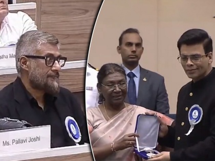 Vivek Agnihotri s strange reaction while Karan Johar was receiving the National Award also cropped from the photo | करण जोहर राष्ट्रीय पुरस्कार घेत असताना विवेक अग्निहोत्रींचे विचित्र हावभाव, फोटोतूनही केलं क्रॉप