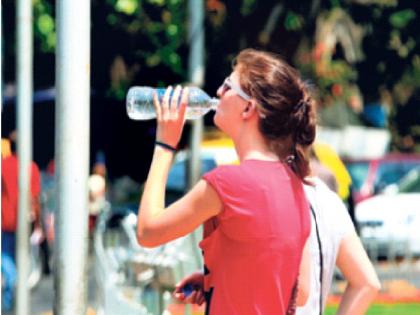 Mumbai's maximum temperature at 35 degrees, citizens sweating; Warning of unseasonal rains maintained | मुंबईचे कमाल तापमान ३५ अंशांवर, नागरिक घामाघूम; अवकाळी पावसाचा इशारा कायम