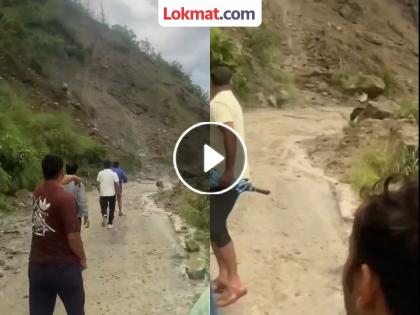 An old man got hit by stones falling from Almora hill in Uttarakhand video viral | VIDEO: घरी जात असतानाच डोक्यात कोसळली दरड; तरुणाने मृत्यूच्या जबड्यातून काढलं बाहेर An old man got hit by stones falling from Almora hill in Uttarakhand video viral | VIDEO: घरी जात असतानाच डोक्यात कोसळली दरड; तरुणाने मृत्यूच्या जबड्यातून काढलं बाहेर