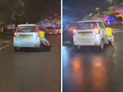 in andheri ghatkopar link road youngster doing stunt in car arrested by police video goes viral on social media  | कारच्या खिडकीला लटकून तरुणाची स्टंटबाजी; शोऑफ करणं चांगलंच भोवलं, VIDEO होतोय व्हायरल  