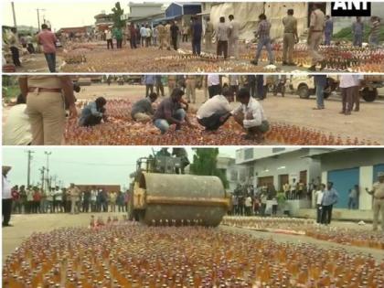 Andhra Pradesh Police has destroyed her by rolling a bulldozer on liquor worth Rs 2 crore | VIDEO:तब्बल २ कोटी रूपयांच्या दारूच्या बाटलांवर पोलिसांनी फिरवला बुलडोझर 