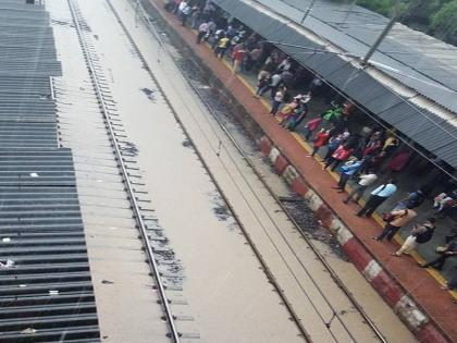 Heavy rains in Mumbai suburbs | मुंबईसह राज्यभरात जोरदार पाऊस, मध्य रेल्वेची वाहतूक उशिरानं