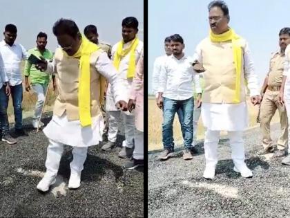 UP news, up-mla-bedi-ram-uprooted-the-road-by-rubbing-it-with-shoes-video-going- | Video: इतका भ्रष्टाचार..! आमदाराने पाय घासताच डांबरी रस्ता उखडला; अधिकाऱ्यांवर संतापले