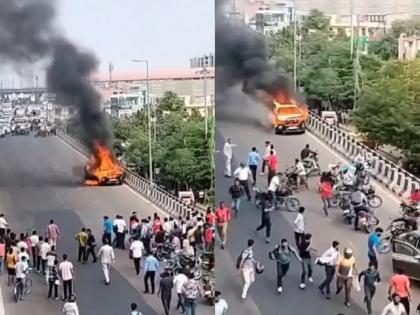 Burning car fell from over bridge in jaipur rajasthan | कारने अचानक घेतला पेट; ब्रिजवरुन खाली घसरताच जीव वाचवण्यासाठी लोक सैरावैरा धावले