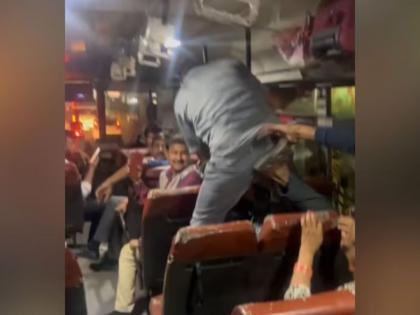 up roadways bus conductor beaten passenger over fare in lucknow video viral | Video - दे दणादण! बसमध्ये कंडक्टर-प्रवाशामध्ये तुफान राडा; लाथाबुक्क्यांनी केली मारहाण