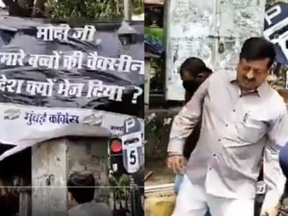 Video: BJP MP manoj kotak tore down anti-Modi banner planted by Congress, trampled on foot | Video : काँग्रेसचा मोदींविरोधातील 'तो' बॅनर भाजपा कार्यकर्त्यांनी उतरवला, पायदळी तुडवला!