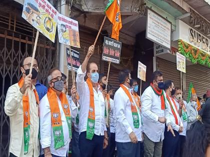 BJP's condemnation agitation at various places in Ulhasnagar to protest against increase in electricity bill | वीज बिल वाढीच्या निषेधार्थ उल्हासनगरातील विविध ठिकाणी भाजपचे धिक्कार आंदोलन