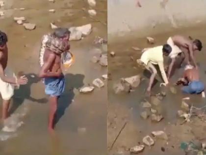 Drunk man wraps python around his neck the son saved his life | VIDEO: दारूच्या नशेत अजगर गळ्यात गुंडाळला, फास बसू लागताच ओरडला; 14 वर्षांच्या मुलानं वडिलांचा जीव वाचवला