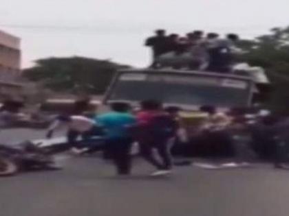 College students in Chennai sit & climb on top of moving buses and hang from window bars of a bus during Bus Day celebrations | VIDEO: ब्रेक लावताच बससमोर कोसळली 20हून अधिक मुलं अन्...