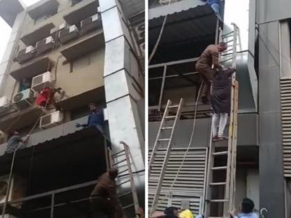 Fire in 5 storied commercial building in Rahatni Firefighters attempt to evacuate civilians | Video: रहाटणीतील ५ मजली व्यावसायिक इमारतीत आग; नागरिकांना बाहेर काढण्यासाठी अग्निशामक दलाचे प्रयत्न