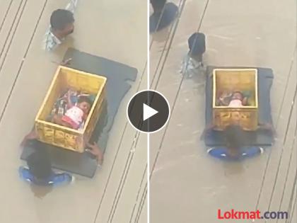 Video heavy rains in telangana andhrapradesh child carrying vegetable crate | पावसाचा हाहाकार! पुराच्या पाण्यात भाजीच्या कॅरेटमधून नेलं बाळ; काळजात चर्र करणारा Video