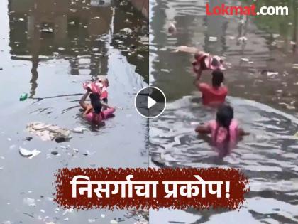 flood wreaks havoc in up prayagraj father saves child like vasudev watch the heart touching video | हृदयस्पर्शी! बाळासाठी वडील झाले वासुदेव, पुराच्या पाण्यातून काढली वाट, भावुक करणारा Video flood wreaks havoc in up prayagraj father saves child like vasudev watch the heart touching video | हृदयस्पर्शी! बाळासाठी वडील झाले वासुदेव, पुराच्या पाण्यातून काढली वाट, भावुक करणारा Video