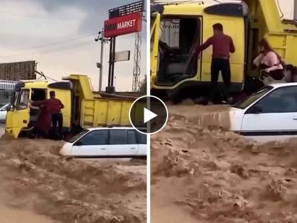 a truck driver rescued 3 family members from flooded car video goes viral on social media | देवमाणूस! पुराच्या पाण्यात अडकलेल्या कुटुंबाची ट्रक ड्रायव्हरने अशी केली सूटका; VIDEO पाहा 