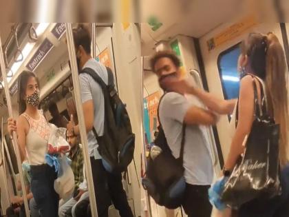 Trending Video viral video of girl slapping boy in metro high voltage drama in train prank video | Trending Video: चालत्या मेट्रोत हाय व्होल्टेज ड्रामा, मुलीनं मुलाच्या कानाखाली लगावल्या थापडा!