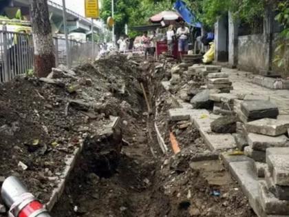 This Dadar footpath wasnt dug up for repairs but by crooks after copper wire | दादरचा हा फूटपाथ पालिकेनं नव्हे, तर चोरांनी खोदला! लाखो रुपये किमतीची MTNL केबल लंपास