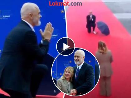 Video Albanian PM Kneels To Greet Italian PM Giorgia Meloni At EU Summit | Video - जॉर्जिया मेलोनींच्या स्वागतासाठी अल्बेनियाचे पंतप्रधान भर पावसात गुडघ्यावर बसले अन्... Video Albanian PM Kneels To Greet Italian PM Giorgia Meloni At EU Summit | Video - जॉर्जिया मेलोनींच्या स्वागतासाठी अल्बेनियाचे पंतप्रधान भर पावसात गुडघ्यावर बसले अन्...