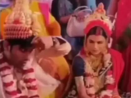 VIDEO : Groom filling sindoor own hairline in wedding watch bride's reaction funny video | VIDEO : लग्नात नवरदेवाने भरलं स्वत:च्या भांगेत कुंकू, नवरीचे हावभाव पाहून पोटधरून हसाल!