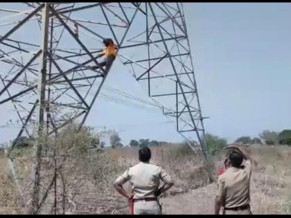 Husband climbe on Hightension Tower for his wife's visit | पत्नीच्या भेटीसाठी पती चढला हायटेन्शन टॉवरवर