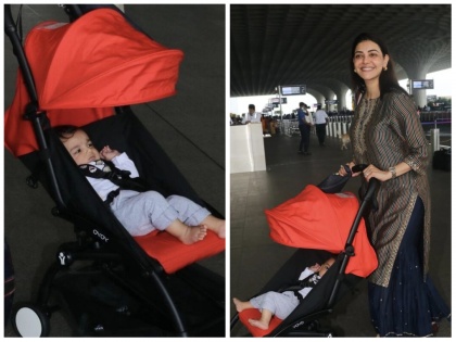 entertainment ctress kajal agarwal spotted with her baby neil and husband at mumbai airport video is going viral watch video | Video : सो क्यूट! काजल अग्रवालने मुलाचा चेहरा दाखवला, सहा महिन्यांनी झाली स्पॉट
