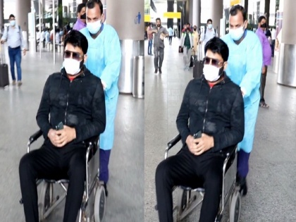 kapil sharma spotted at airpor on wheelchair open up about reason | कपिल शर्माला का घ्यावा लागला व्हिलचेअरचा आधार? स्वत: सांगितले कारण