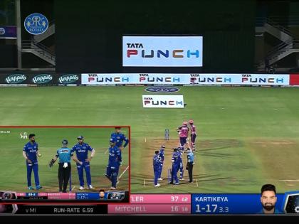 IPL 2022, MI vs RR Live Updates : Seems like Kumar Kartikeya is asking for the sight screen advert behind the batter be switched off | Kumar Kartikeya IPL 2022, MI vs RR Live Updates : पदार्पणवीर कुमार कार्तिकेयचा 'अजब' हट्ट धरला, रोहित शर्माची Umpireकडे धाव अन् थांबवावा लागला सामना! 