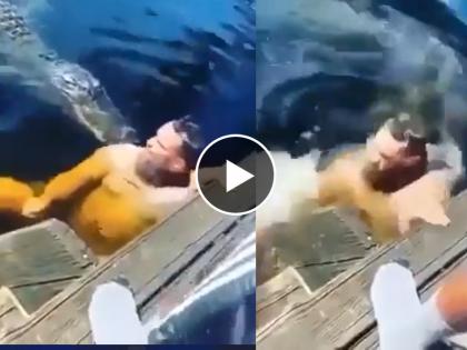 man swims into water with crocodile see what happens next it is shocking video goes viral on internet | Viral Video: मगरींनी भरलेल्या पाण्यात स्विमिंग करायला गेला अन् आयुष्यभर पस्तवाण्याची आली वेळ