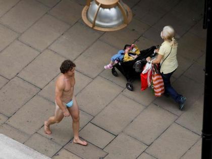 In Pics! Man walks down London Street wearing 'Nothing' but a 'Mask'
