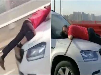 Watch Video : Woman drives 13 km with man on car after road rage incident | Video : 'तिनं' झाडू तोडल्यानं 'तो' भडकला, कारच्या बोनेटला लटकला; अन्...