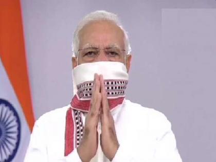 pm modi gives important message by using gamcha while announcing lockdown extension kkg | CoronaVirus: लॉकडाऊन वाढवण्याची घोषणा करताना मोदींनी गमछातून दिला खास संदेश; तुम्हाला समजला का?