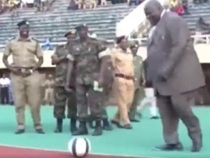 Video of Ugandan deputy PM’s epic fall after kicking a football goes viral | स्पर्धेच्या उद्घाटनावेळी उप पंतप्रधानांनी मारली फुटबॉलला किक, पण...