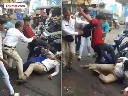 Two traffic policemen severely beaten by father and son in Nallasopara | VIDEO: नालासोपाऱ्यात वाहतूक पोलिसांना बाप-लेकाकडून जबर मारहाण; लायसन्सवरुन झाला वाद Two traffic policemen severely beaten by father and son in Nallasopara | VIDEO: नालासोपाऱ्यात वाहतूक पोलिसांना बाप-लेकाकडून जबर मारहाण; लायसन्सवरुन झाला वाद