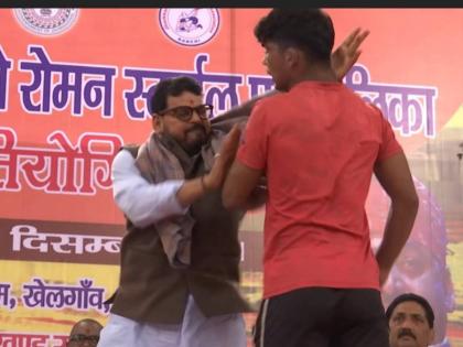 bjp mp brij bhushan singh slaps wrestler video goes viral on social media | Brij Bhushan Sharan Singh: खासदारानं भर व्यासपीठावरच कुस्तीपटूला कानशिलात लगावली, Video व्हायरल